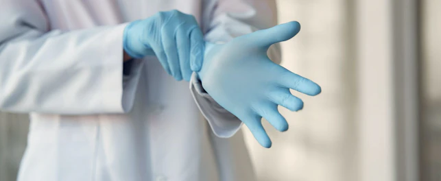 Doctor Wearing Surgical Gloves
